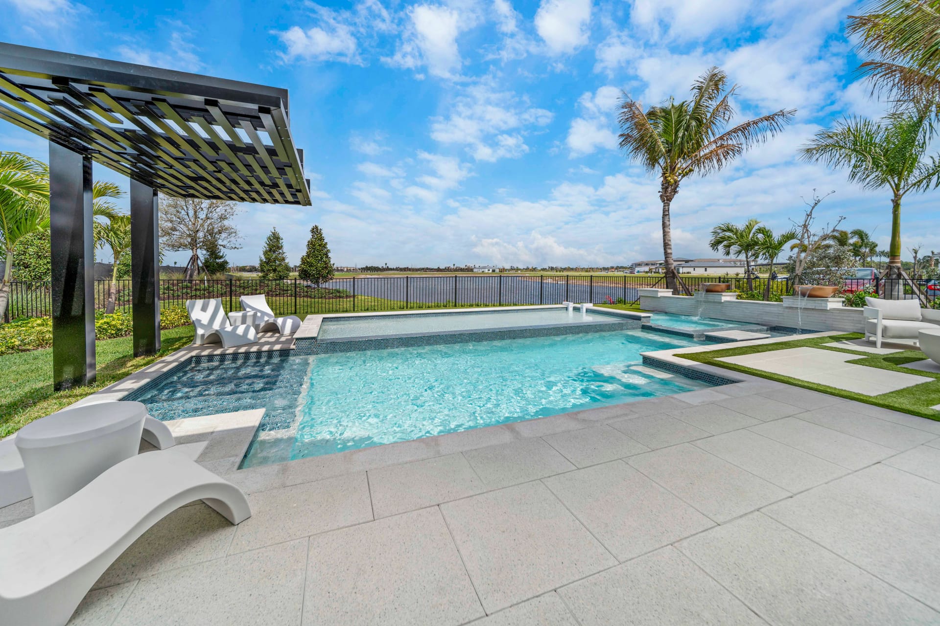 Geometric modern rectangular pool with minimalist stone hardscape and precise edge work at evening - Swim Inc. custom pool Sarasota