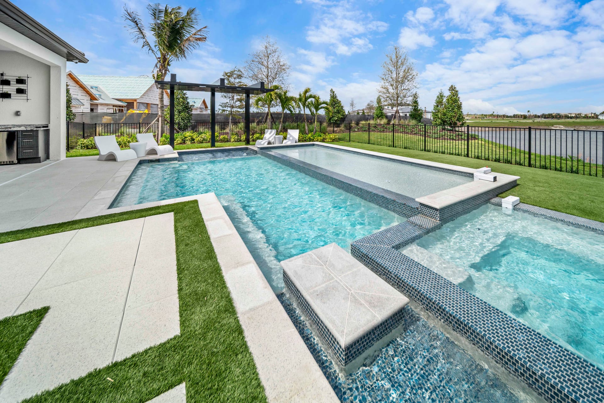Geometric modern custom pool by Swim Inc. - the design-build work Seminole homeowners receive on Bardmoor and mid-Pinellas properties