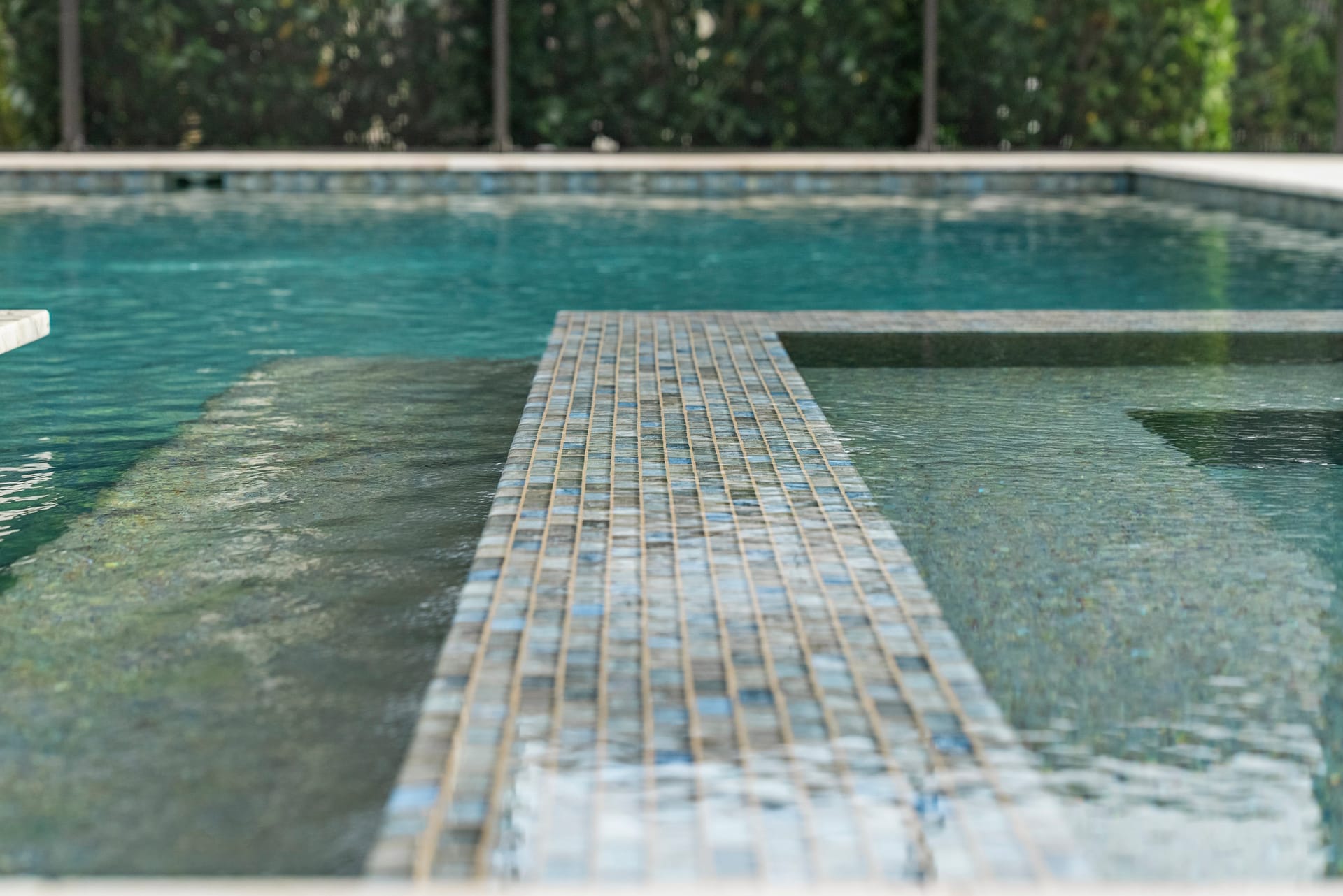 LED bubblers and color-changing lighting on resort-style pool in Sarasota, FL, Swim Inc.