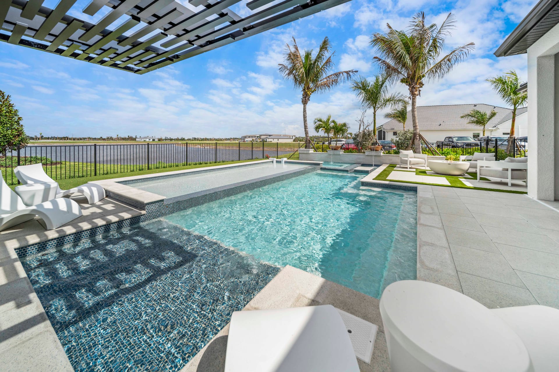 The Snellings' completed custom pool in Lakewood Ranch with spa and sun shelf at warm evening light