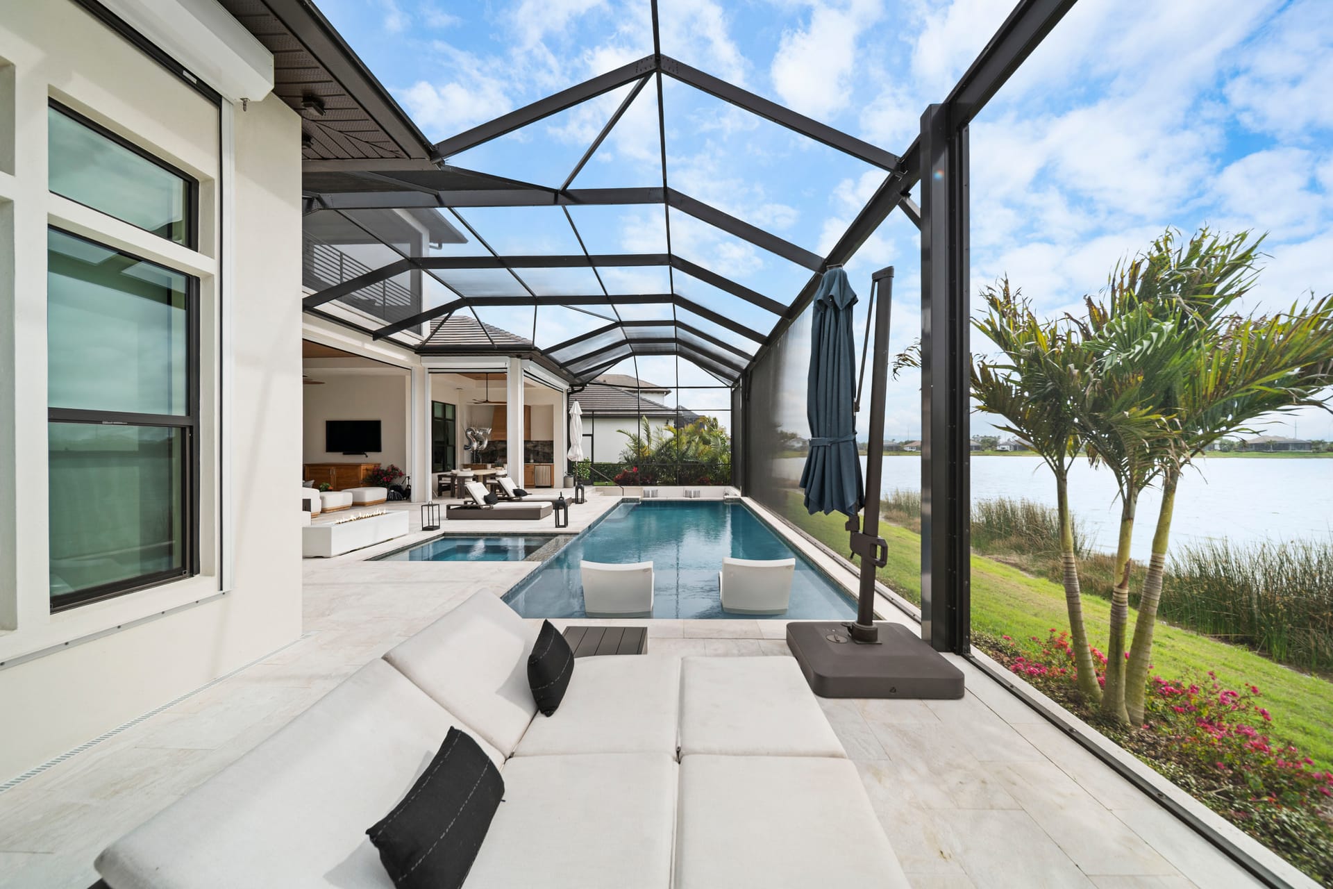 Custom pool design and construction on Siesta Key, FL - Swim Inc. vanishing edge pool on a Gulf-adjacent waterfront property